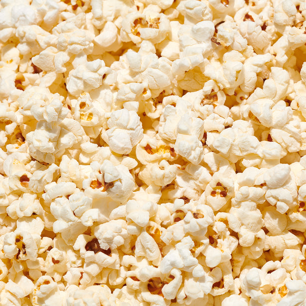 close up of binge watching buttery seasoned popcorn