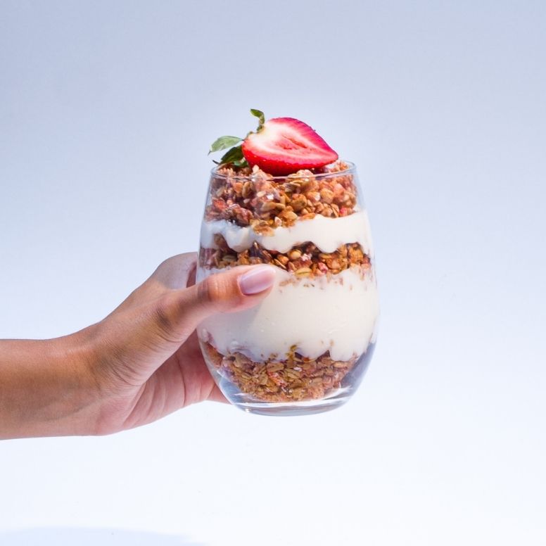 hand holding strawberry shortcake granola parfait