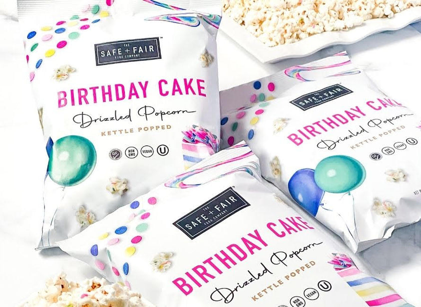 three bags of birthday cake drizzled popcorn